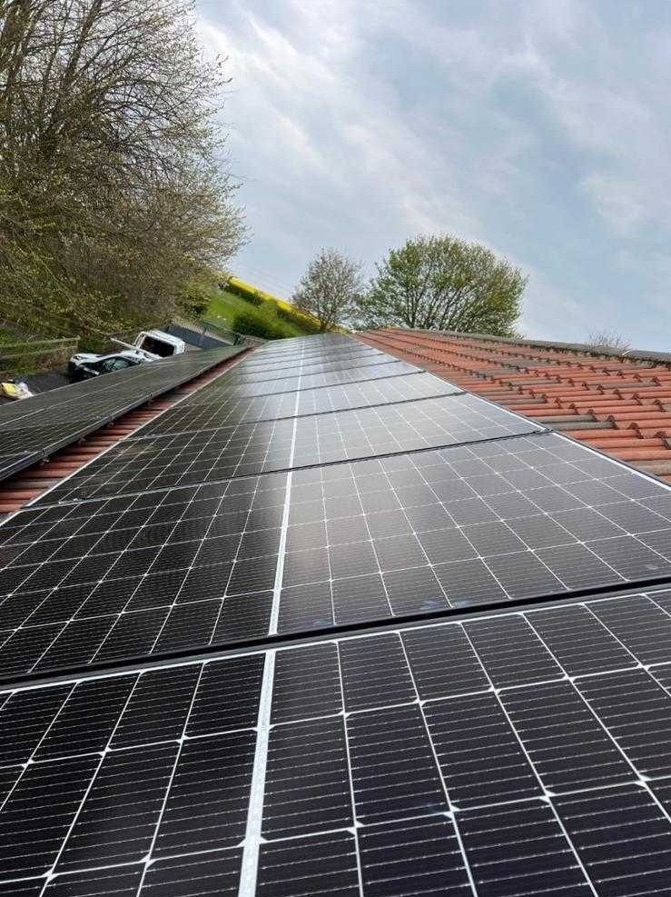 Close-up view of solar panels installed on a tiled roof