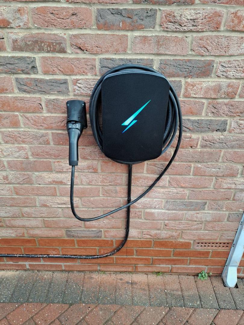 EV charger with weatherproof cover installed