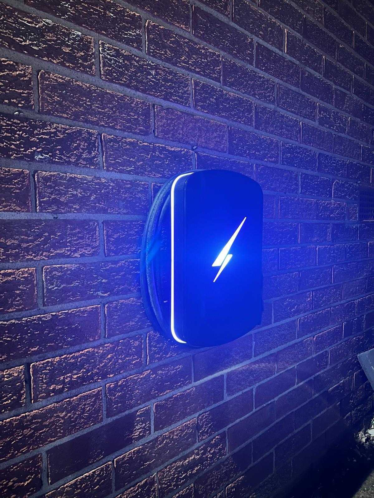 EV charger installed, illuminated at night